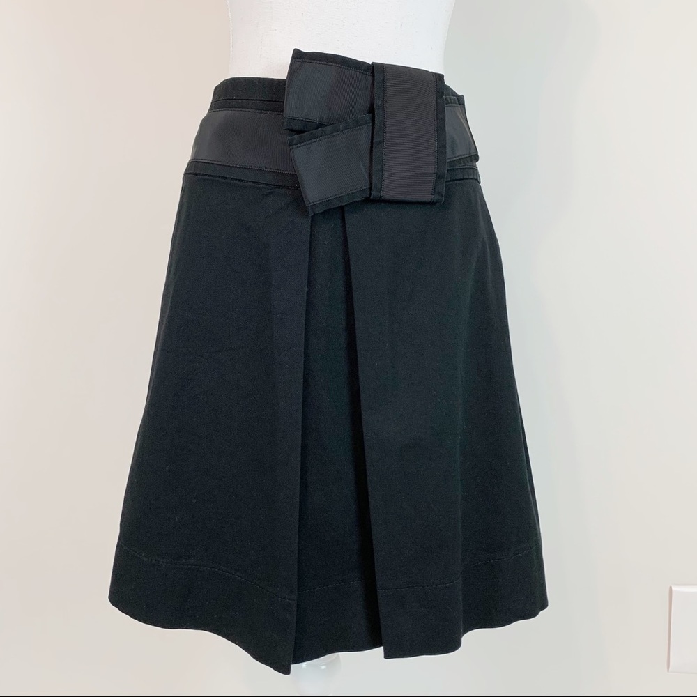 The limited pleated ribbon bow a-line skirt